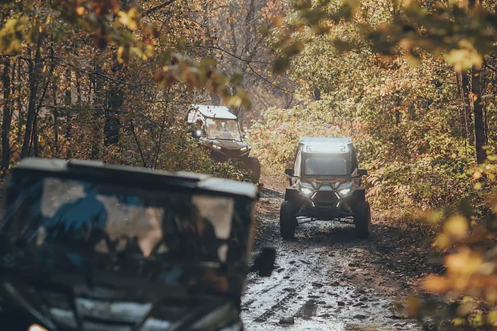 Side by side ATVs on a forest trail in Lakewood, WI